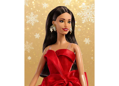 Barbie 2026 Holiday Doll wearing red bow-detail gown with long brown hair and silver drop earrings