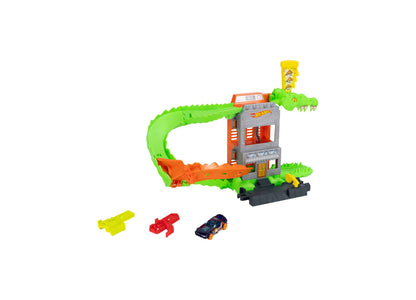 Hot Wheels City Croc Pizza Attack Playset with green crocodile track, orange building, and die-cast cars