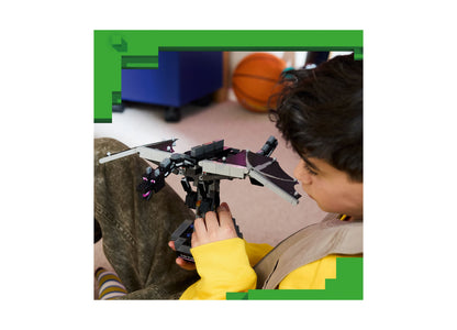Child playing with LEGO Minecraft The Ender Dragon 21595 building set featuring black and white dragon with purple wings