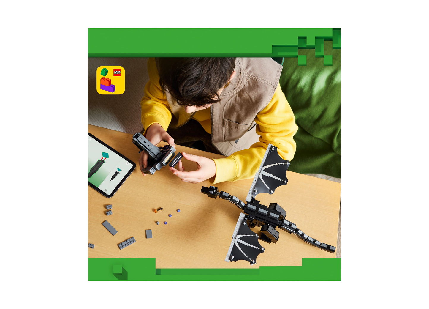 LEGO Minecraft Ender Dragon 21595 building set with black dragon wings and pieces displayed on wooden table