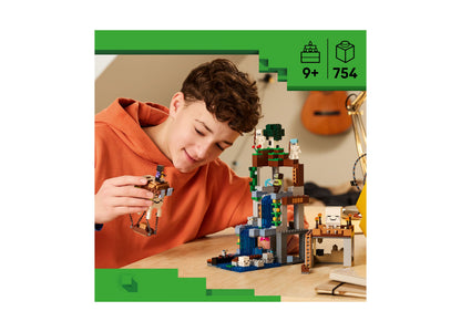 Boy in orange hoodie building LEGO Minecraft Ghast Station set with 754 pieces