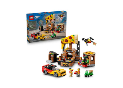 LEGO City Pizza Delivery Experience 60496 set with yellow pizza shop, red delivery car, green scooter, and minifigures