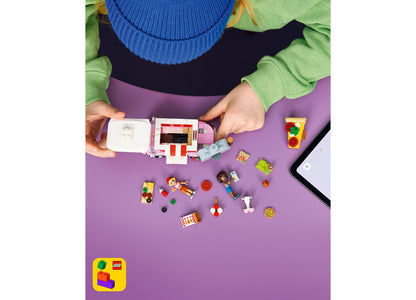LEGO Friends Pizza Truck 42694 building set with colorful pieces displayed on purple surface