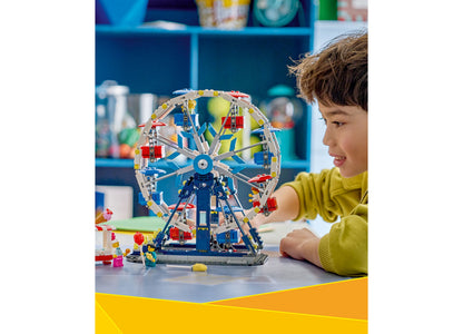 LEGO Creator Iconic Ferris Wheel 31389 building set with blue, red, and yellow pieces, displayed by child