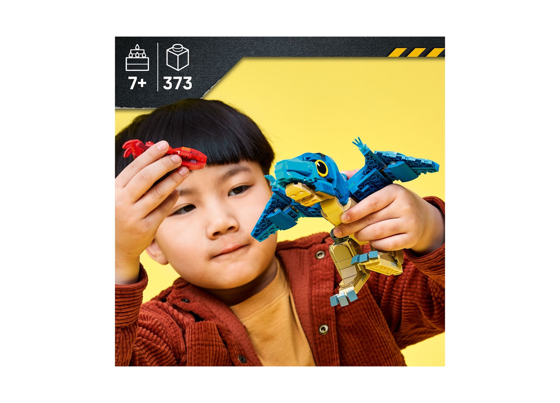 LEGO Jurassic World Pteranodon 77977 blue and yellow dinosaur building set with child playing