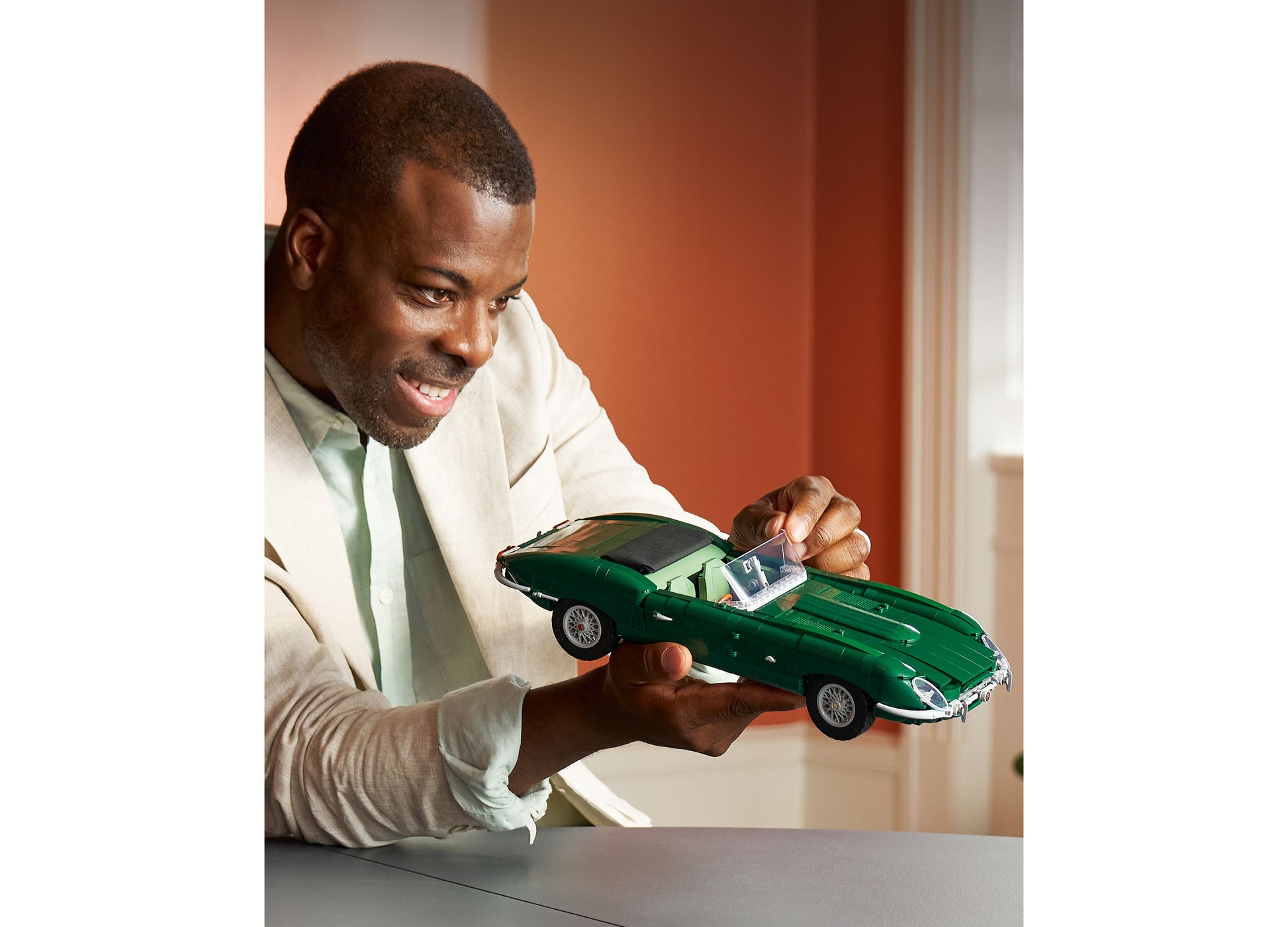LEGO Icons Jaguar E-Type 11381 green sports car model displayed in hands