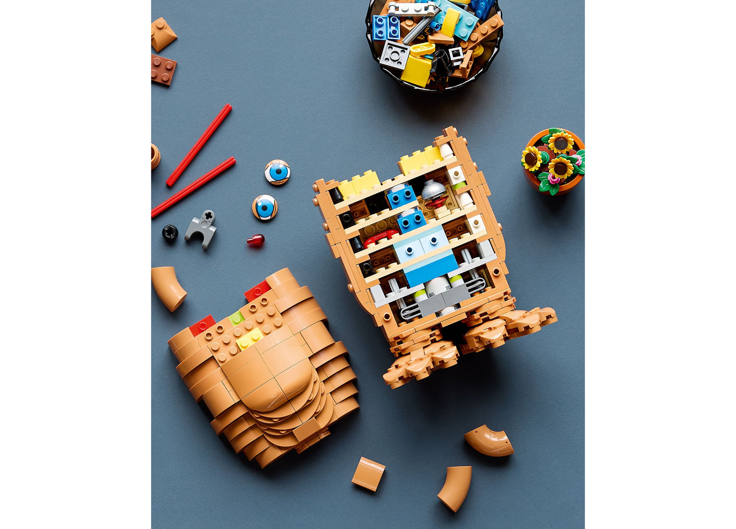 LEGO E.T. the Extra-Terrestrial 21370 building set with tan and brown pieces, featuring E.T. figure and accessories o...