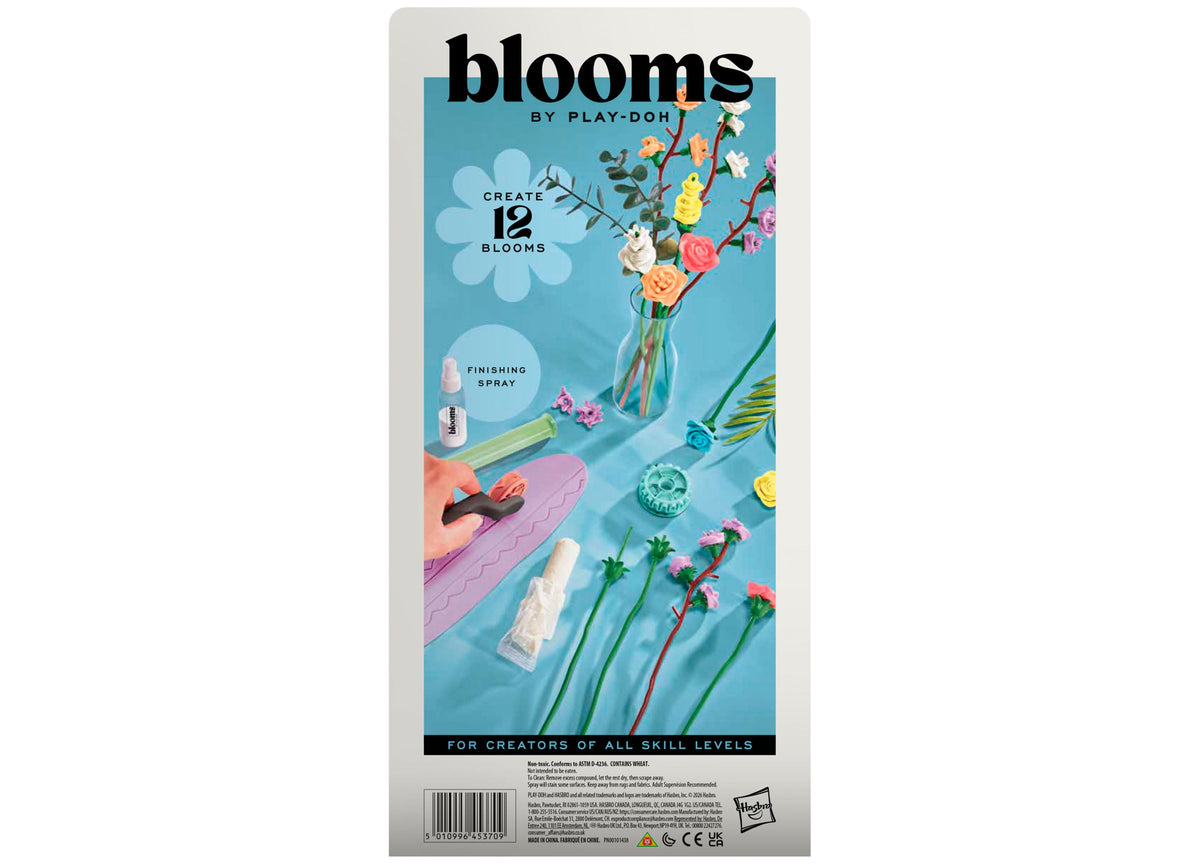 Play-Doh Blooms Wildflower Petite Bouquet Kit with 12 colorful flowers in vase, tools, and finishing spray on blue ba...