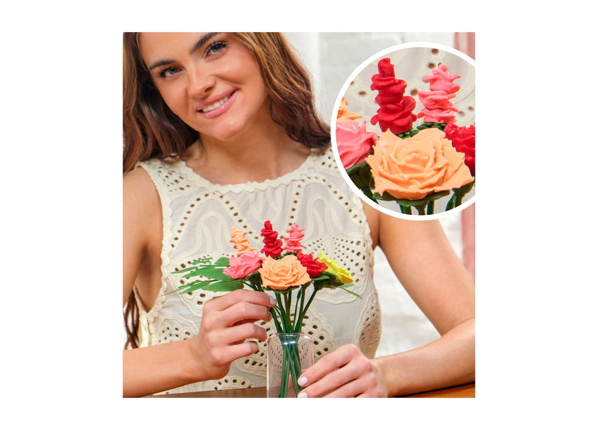 Play-Doh Blooms Rosy Petite Bouquet Flower-Making Kit with red, pink, and orange flowers in vase