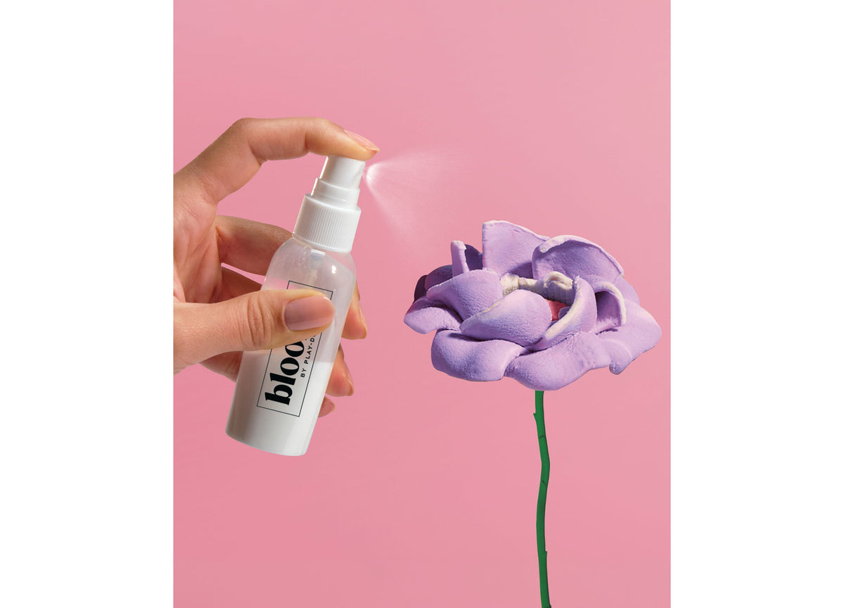 Play-Doh Blooms DIY Garden Bouquet Kit with purple flower on pink background