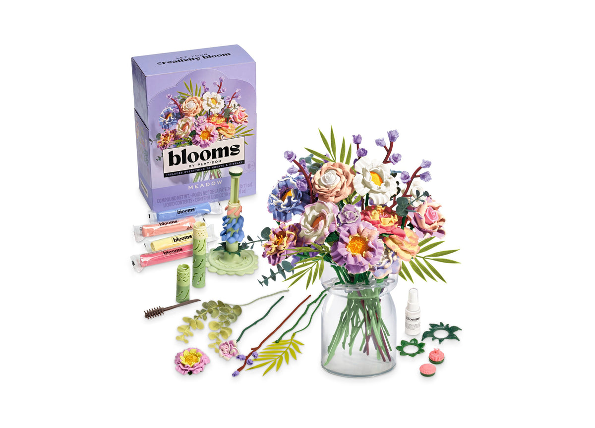 Play-Doh Blooms Meadow Bouquet kit with purple box, molding tools, colorful flowers in glass vase, and accessories