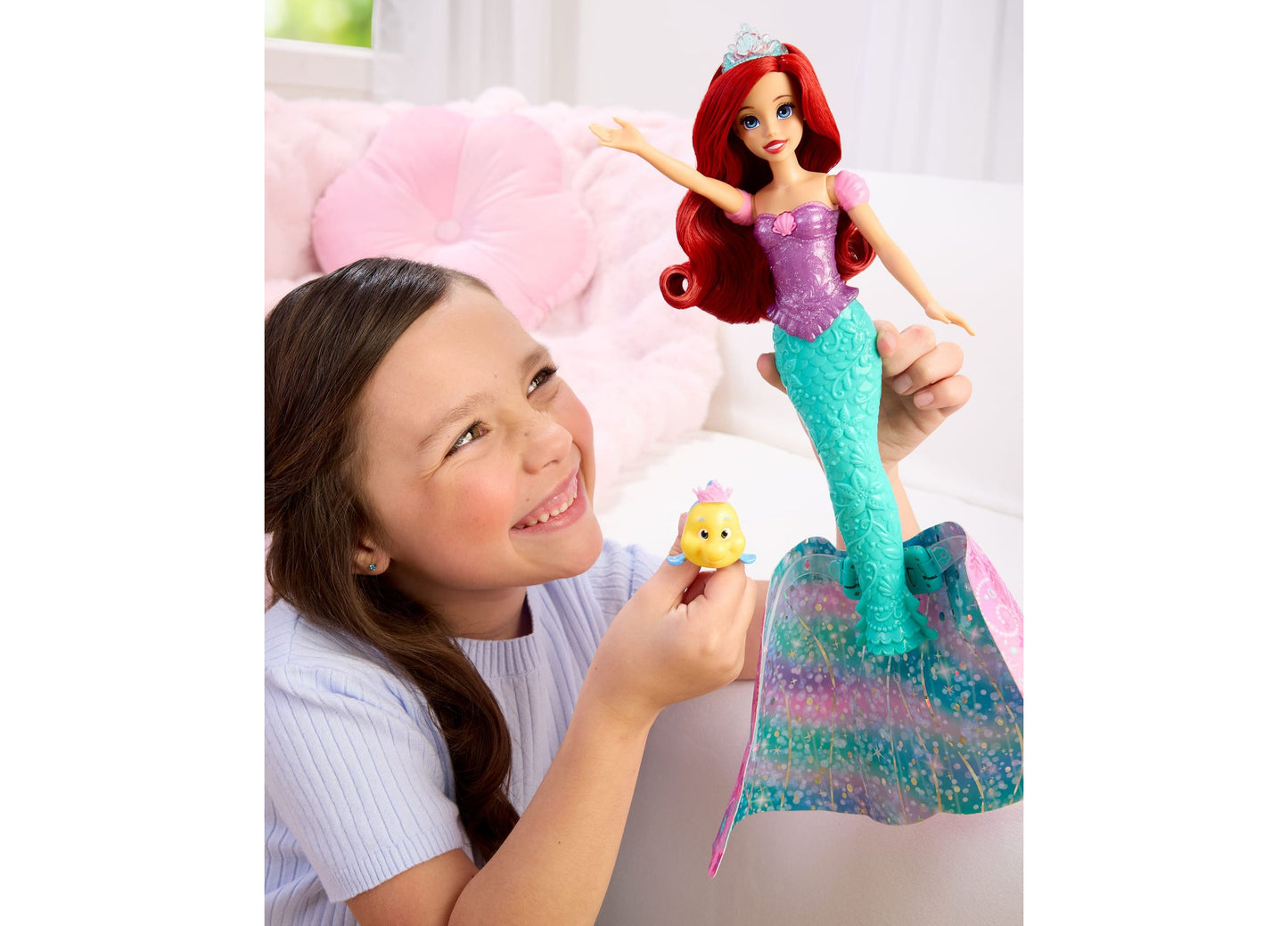 Disney Princess Transforming Ariel Fashion Doll with red hair, purple top, turquoise tail, tiara, and Flounder accessory