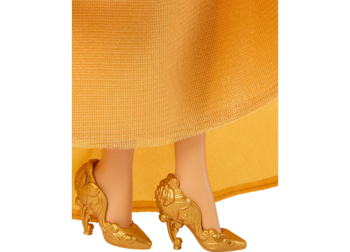 Disney Princess Belle fashion doll wearing yellow gown with gold ornate heels and accessories
