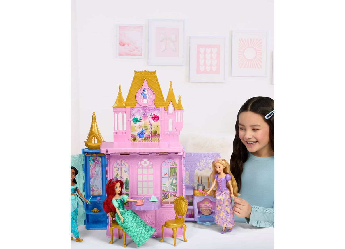Disney Princess Rapunzel Close & Carry Castle playset with pink castle, gold towers, Rapunzel doll in purple dress, a...