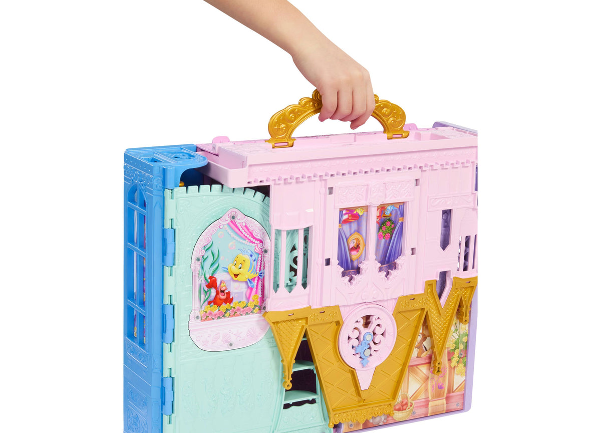 Disney Princess Rapunzel Close & Carry Castle playset in pink and blue with golden handles, featuring multiple play a...