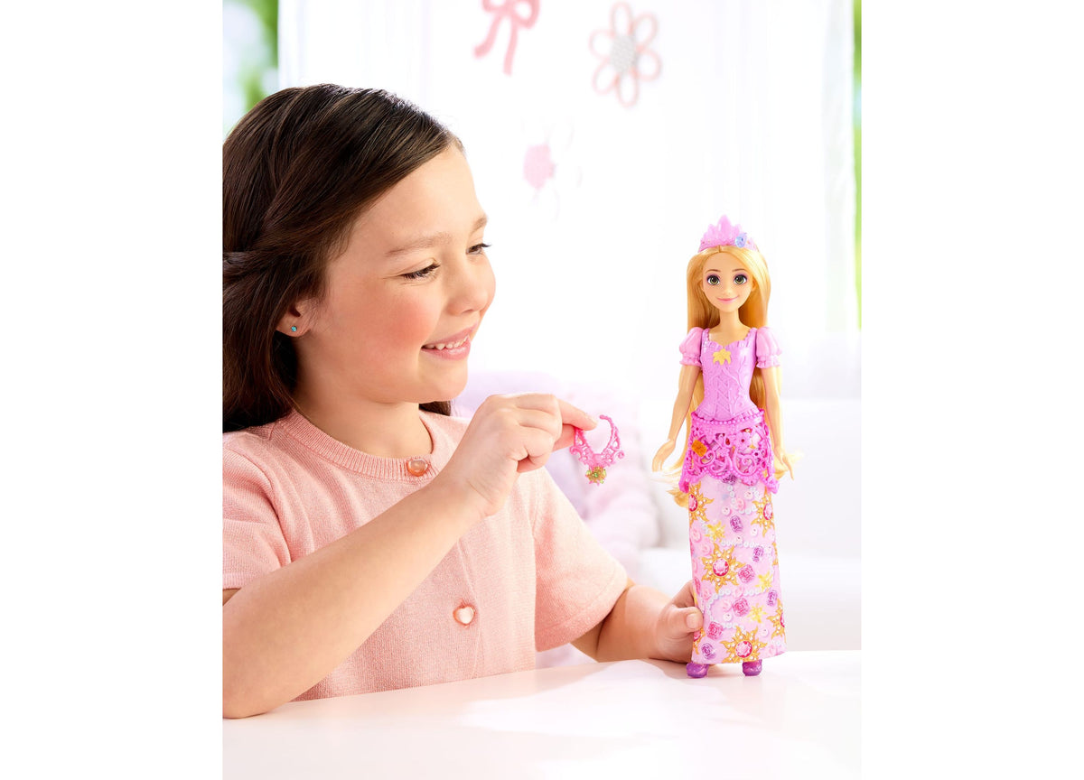 Disney Princess Jewel Reveal Rapunzel doll in pink gown with tiara, shown with ring accessory