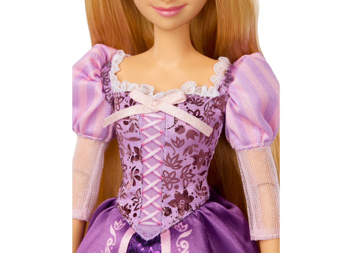 Disney Princess Rapunzel 13" doll wearing purple sparkly gown with puffed sleeves and white lace trim