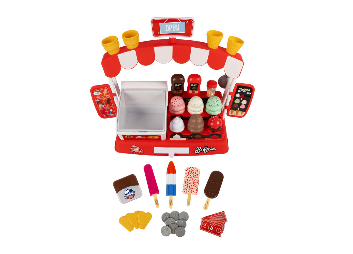 Casdon Ice Cream Parlor playset with red storefront, freezer display, ice cream scoops, popsicles, play coins, and menus