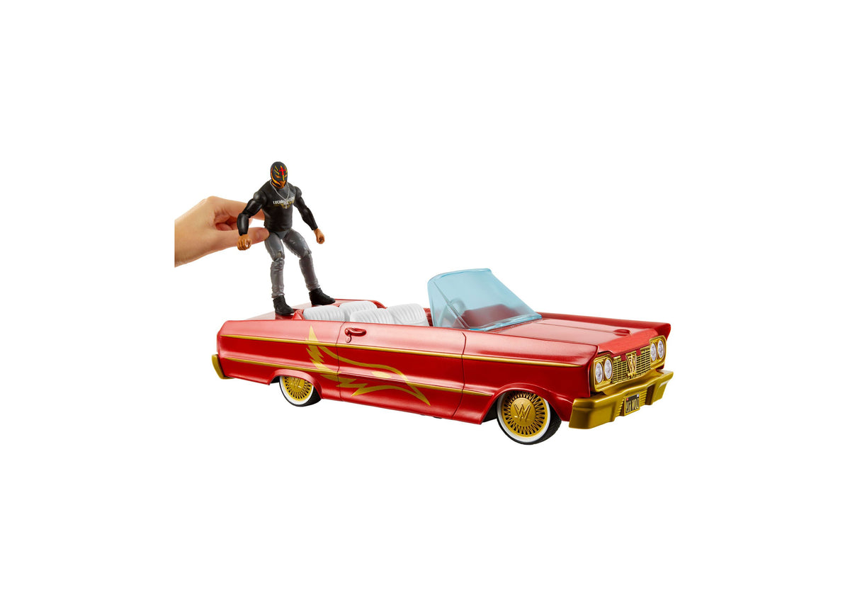 WWE Rey Mysterio action figure on red and gold lowrider car with hydraulics