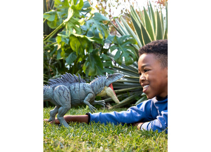 Blue Jurassic World Giganotosaurus 28-inch action figure with child on grass