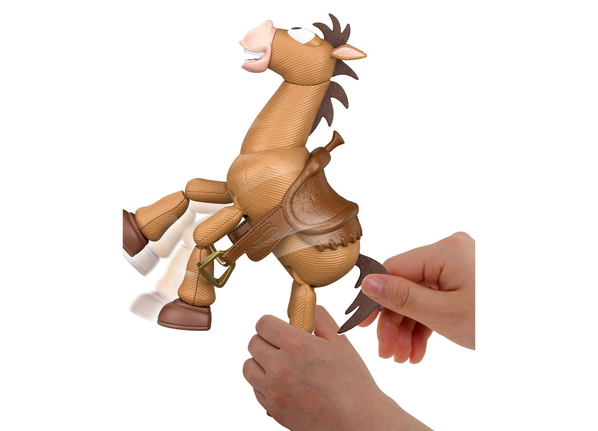 Toy Story Bullseye 12" figure with tan and brown coloring, shown rearing up with articulated limbs, held in child's h...