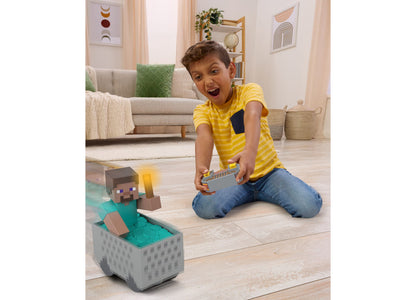 Boy in yellow shirt controls Minecraft RC minecart with remote, minecart features turbo boost and wheelie stunt capab...