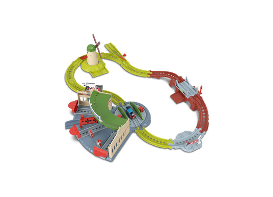 Thomas & Friends Explorin' Tidmouth Sheds train set with green track, red station buildings, and helicopter landing pad