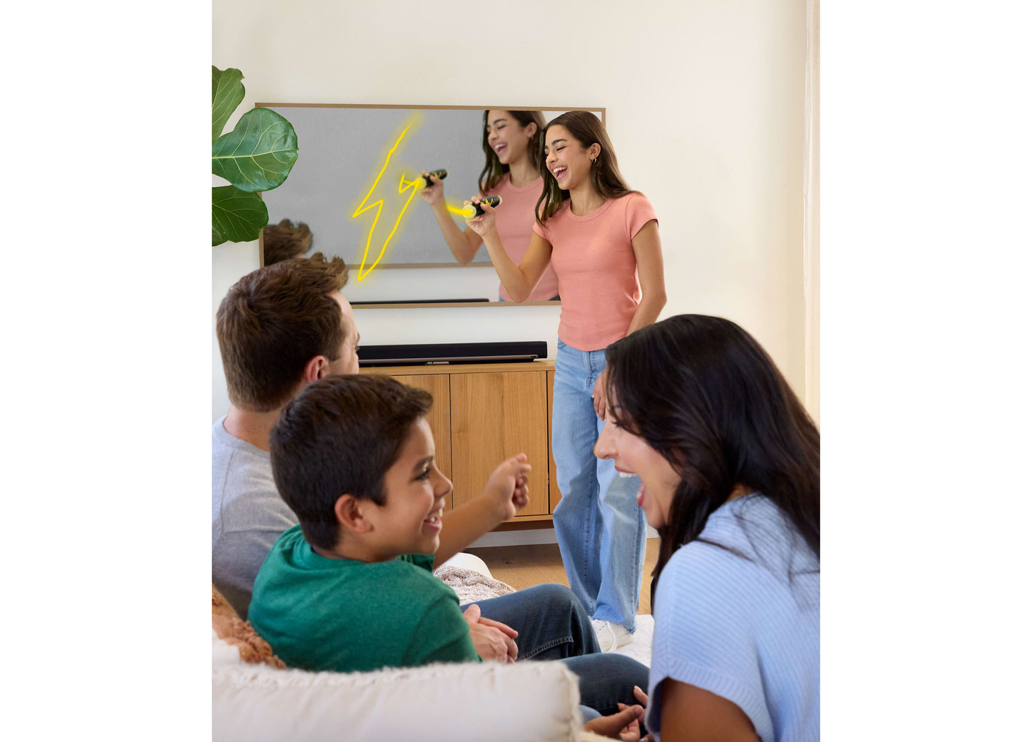 Mattel Pictionary Air Takeover Drawing Game being played by family with wireless stylus