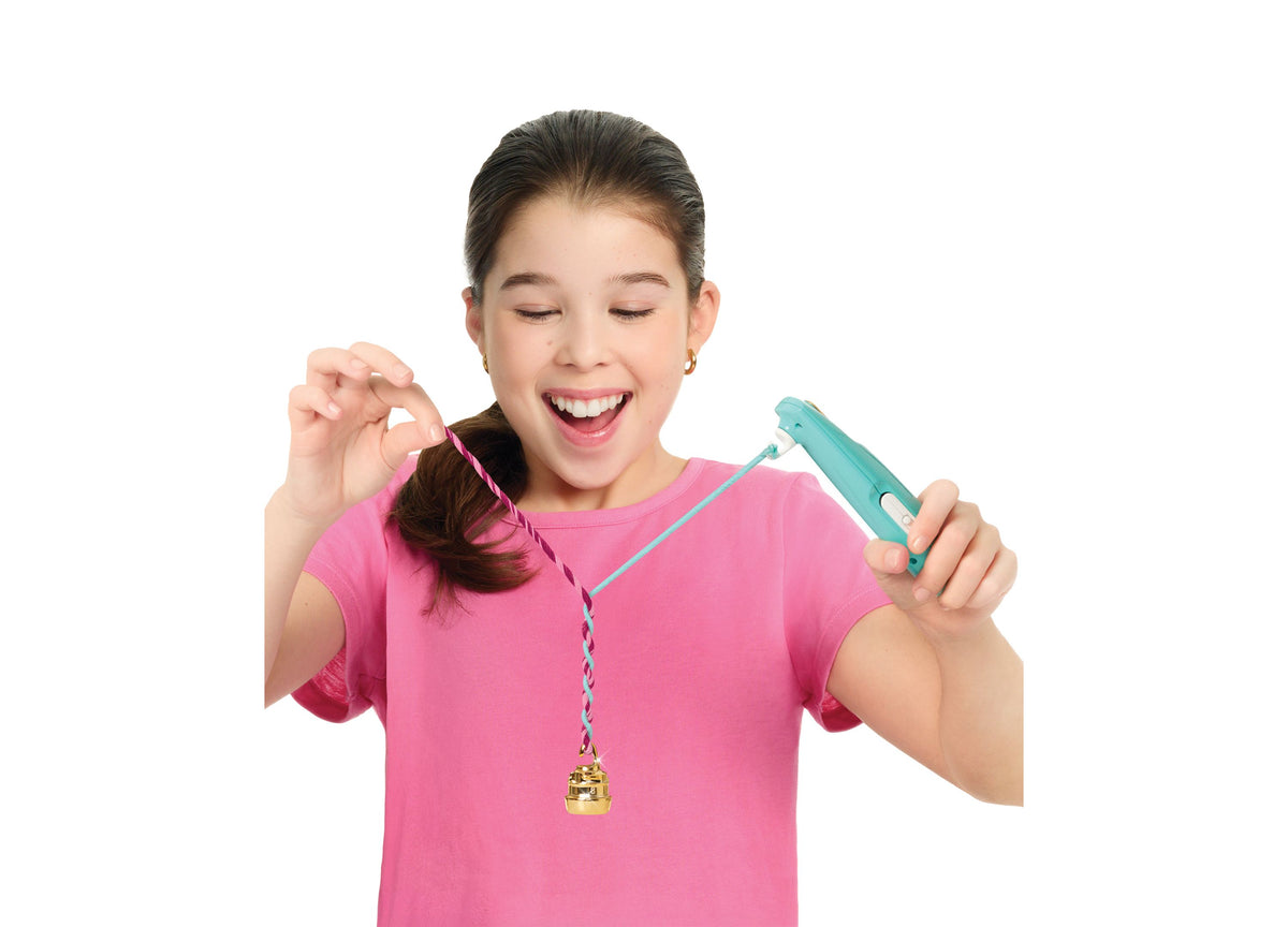 Girl in pink shirt holding turquoise Quick Twist Bracelet Maker with pink and blue twisted cord bracelet