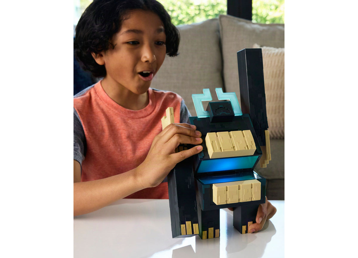Child playing with Minecraft Twisted Warden & Soul Corrupted Creeper Lights & Sounds Slam Attack Figures 2-Piece set