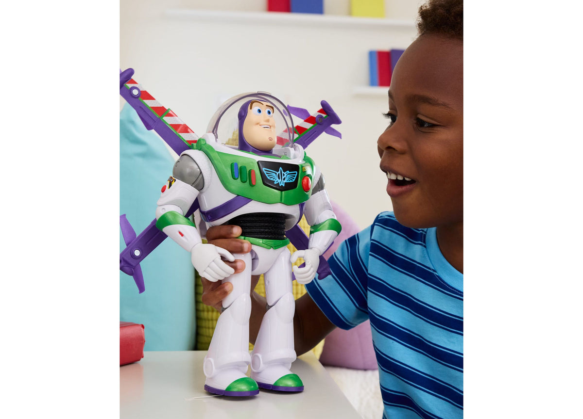 Toy Story Buzz Lightyear action figure with purple wings held by child in blue striped shirt