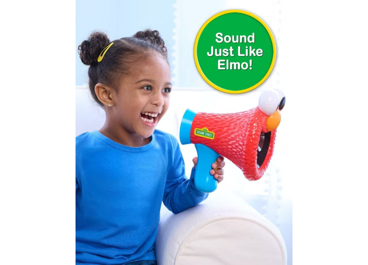 Girl holding red and blue Sesame Street Elmo megaphone with voice-changing feature