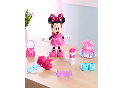 Minnie Mouse 6-inch poseable doll with pink bow, wearing hot pink dress, surrounded by two outfits, shoes, and access...