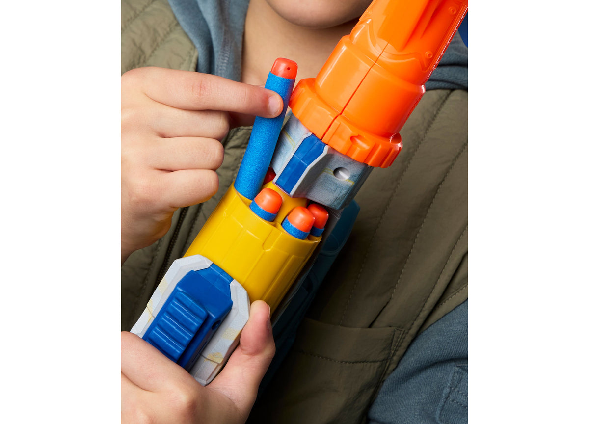 Child holding Nerf Star Wars Mandalorian blaster with orange, blue, and yellow colors and rotating dart cylinder