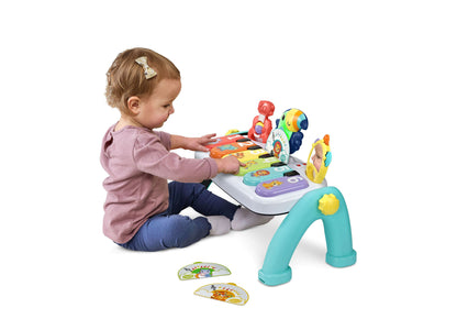 VTech Create & Discover Learning Musical Piano in turquoise with toddler playing colorful keys