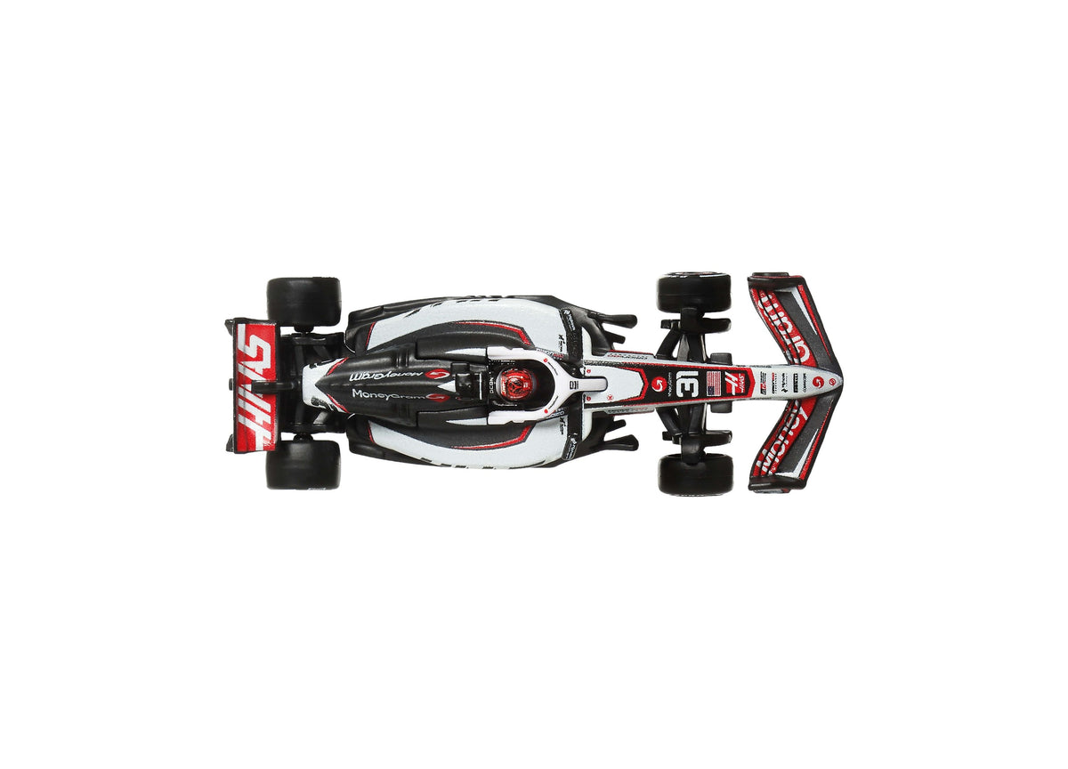 Hot Wheels 1:64 Scale MoneyGram Haas F1 Team die-cast race car in white, black and red viewed from above