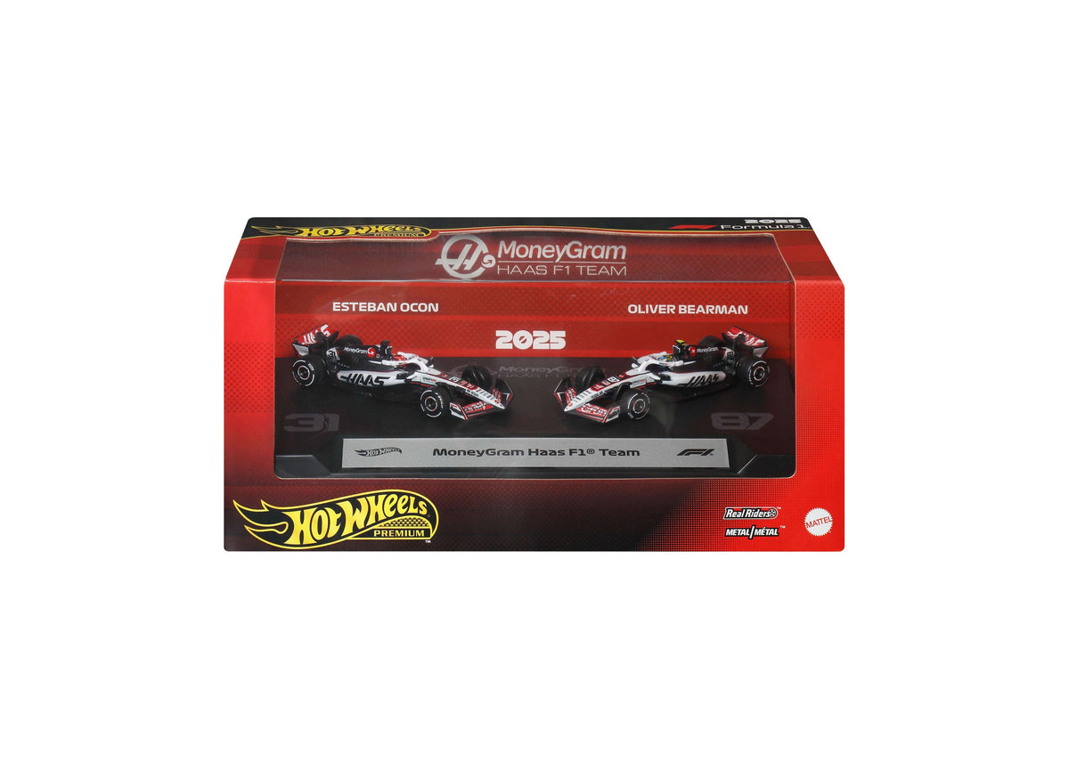 Hot Wheels 1:64 Scale MoneyGram Haas F1 Team 2-Pack with two die-cast race cars and display plinth in red packaging