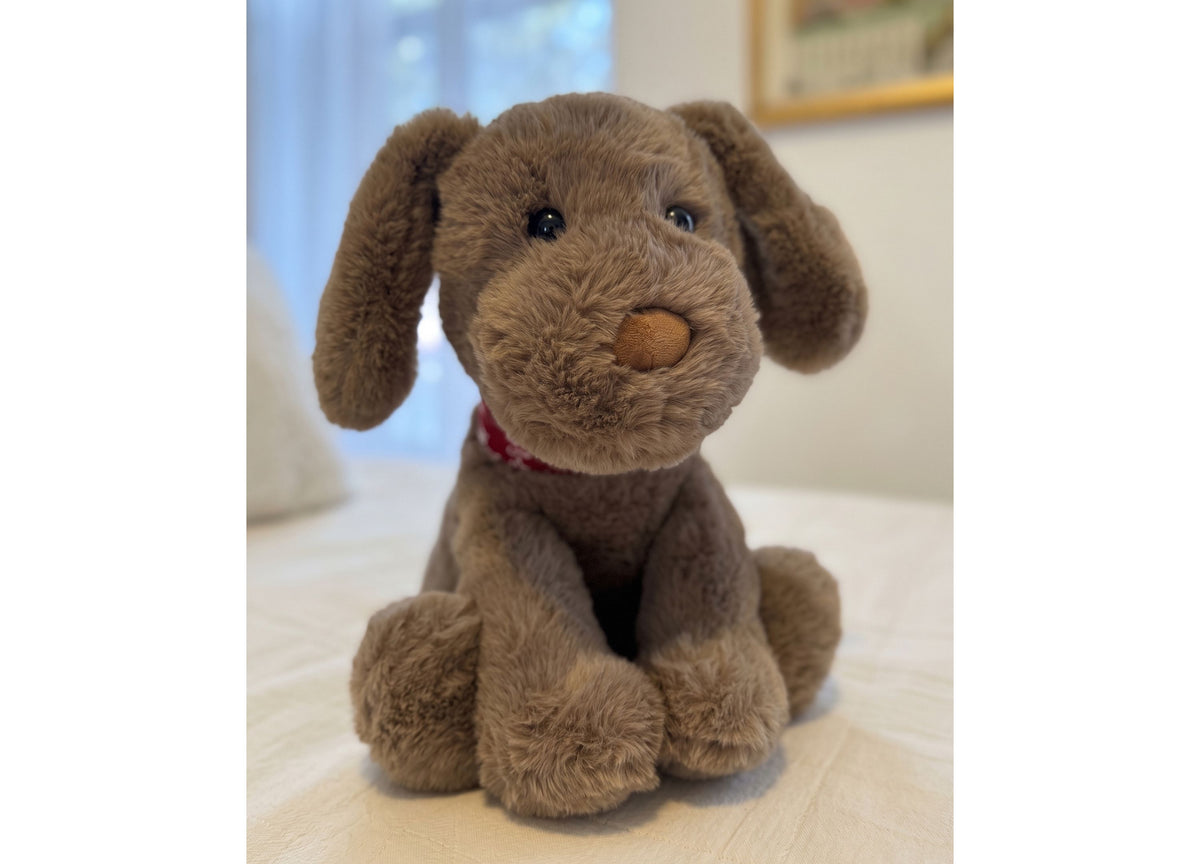 Wild Hippo Holiday Hound plush dog with floppy ears, brown coloring, and patterned knit collar