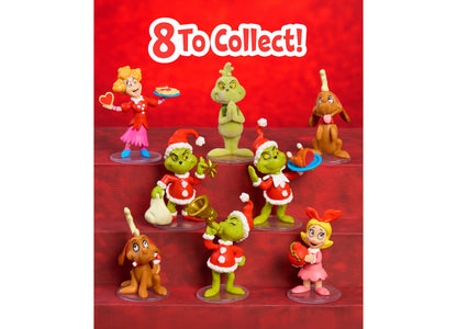 Dr. Seuss Grinch 8-Piece Collectible Figure Set featuring green Grinch characters in red Santa outfits, blonde girl c...