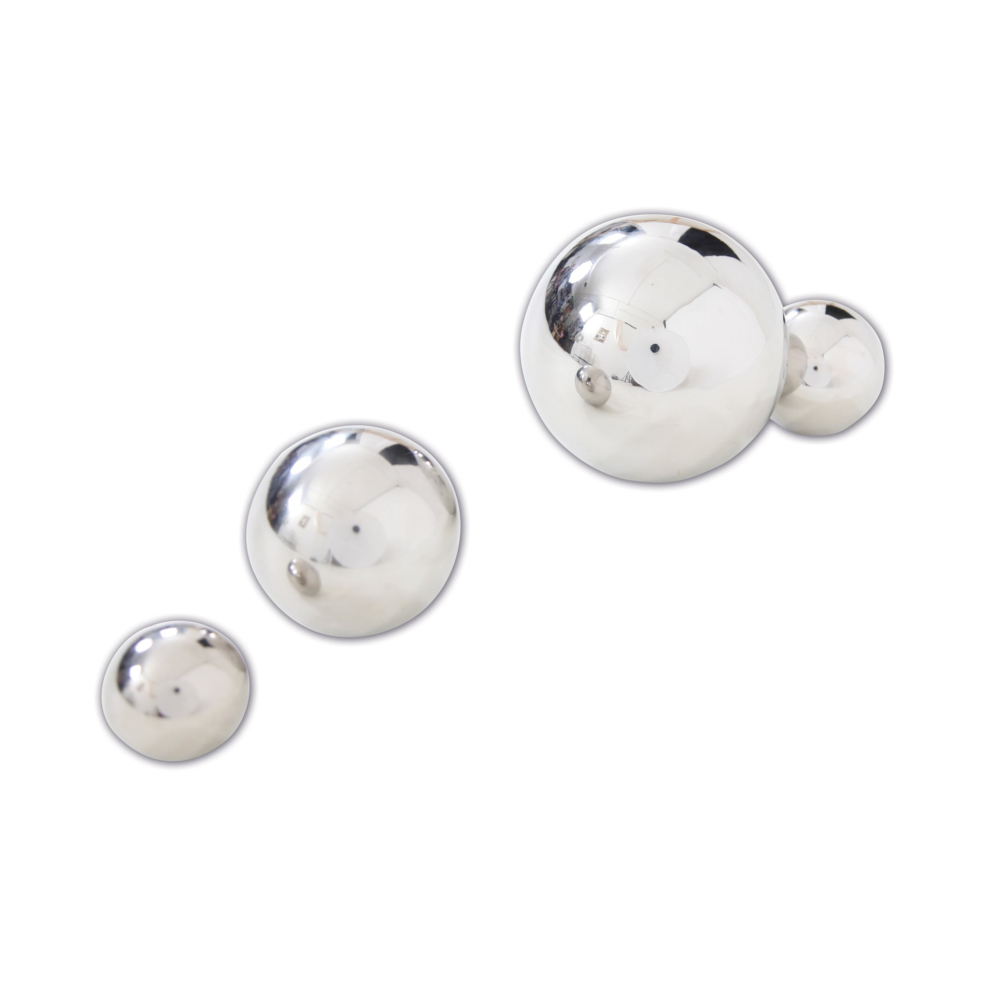 Four silver reflective balls in graduated sizes with mirrored surfaces on plain white background