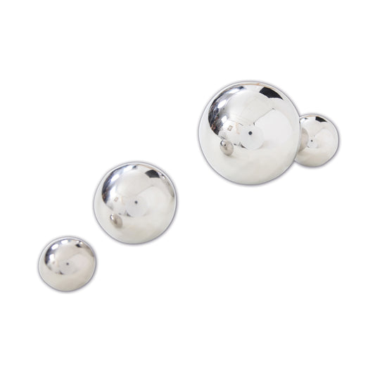 Four silver reflective balls in graduated sizes with mirrored surfaces on plain white background