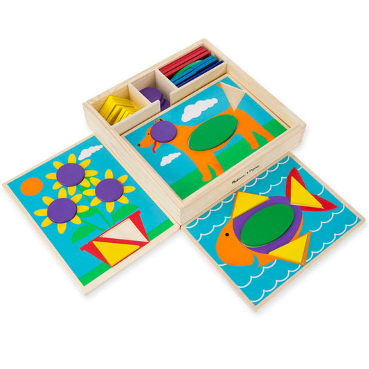 Wooden pattern blocks set with three illustrated scene cards showing colorful shapes arranged as flowers, kites, and hot air balloons, plus storage box with com