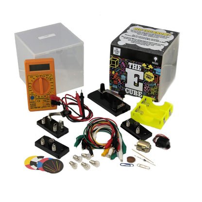 The E Cube Comprehensive Electricity Exploration Kit contents displayed, including orange digital multimeter, colorful circuit boards, black component bases, mu