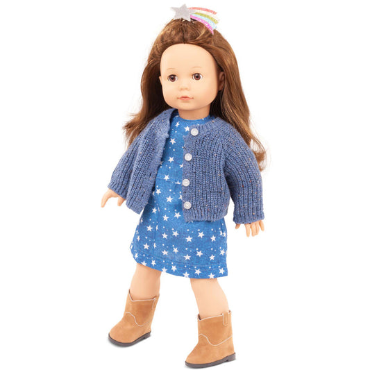 Gotz doll with long brown hair wearing blue star-print dress, blue knit cardigan, tan boots, and rainbow headband with star on plain white background