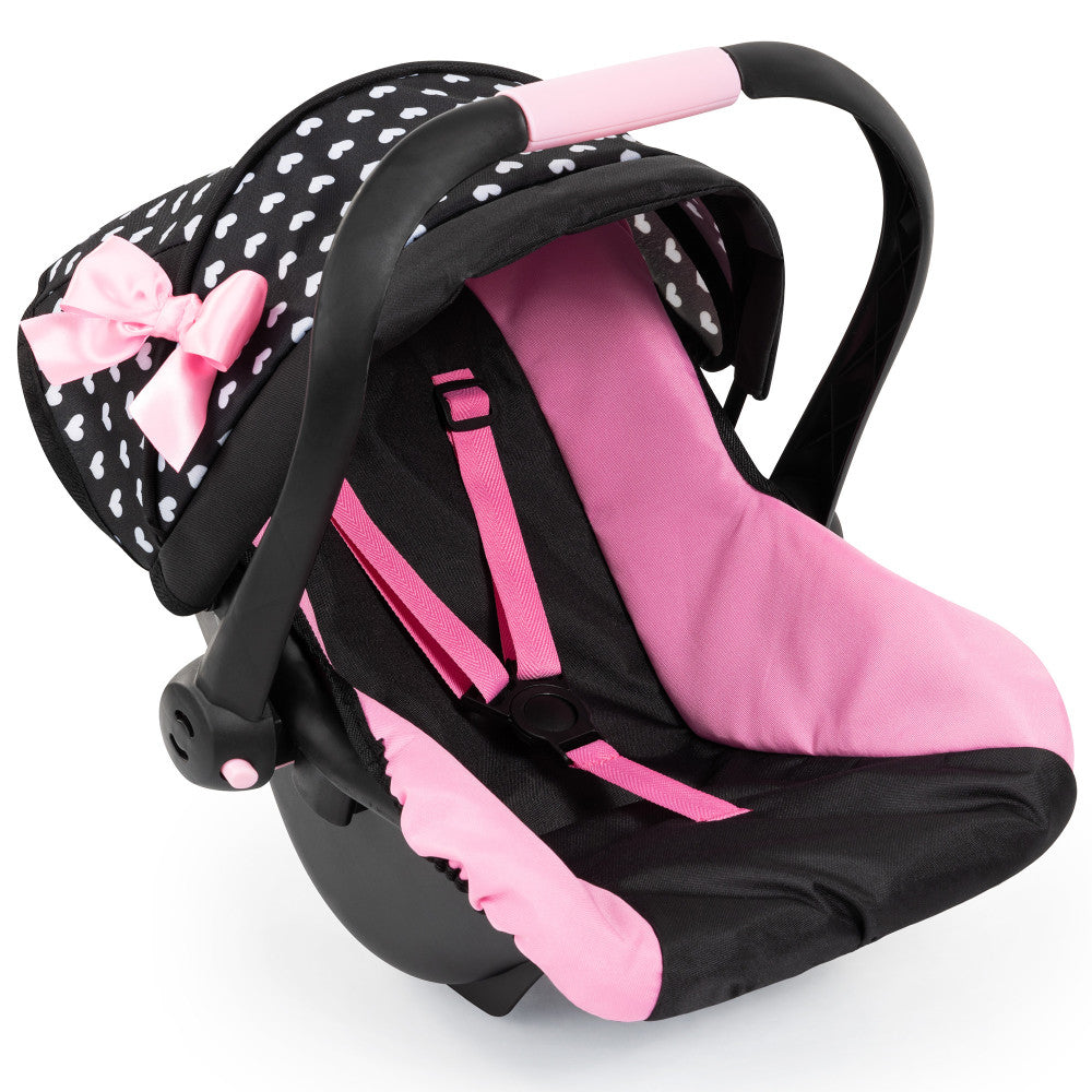 Black and pink doll car seat with white polka dots, pink bow accent, and black handles