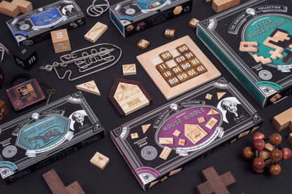 Professor Puzzle Extreme Einstein Atom wooden puzzle collection displayed on black surface with various wooden puzzle boxes and pieces, including numbered block