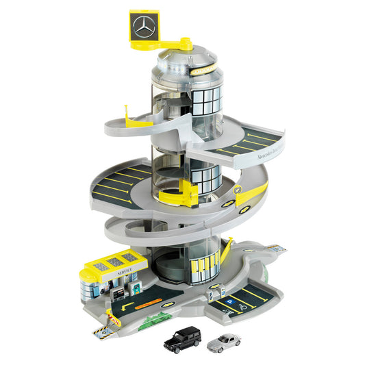 Mercedes-Benz Helix Electric Car Park playset with yellow and gray spiral tower, elevator, multiple parking levels, service station base, and two toy cars