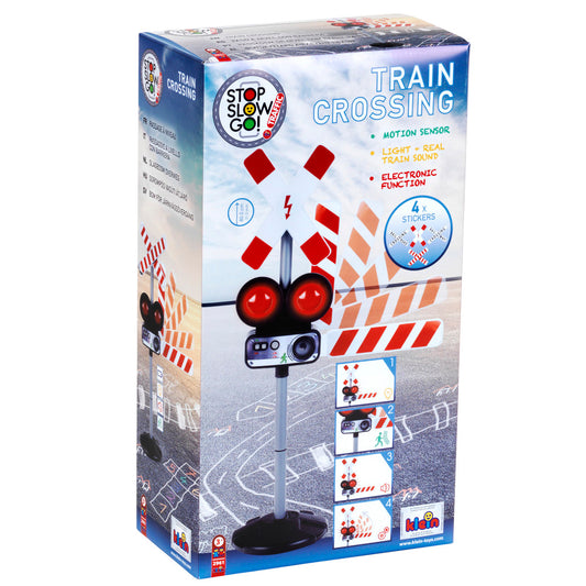 Stop, Slow, Go interactive train crossing traffic light with red lights, motion sensor, and sound effects on display packaging