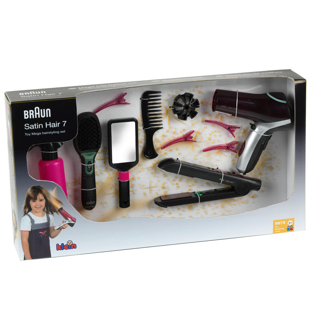 Braun Satin Hair 7 toy hairstyling set in packaging, showing child on model with spray bottle, brush, comb, mirror, hair clips, curling iron, and blow dryer