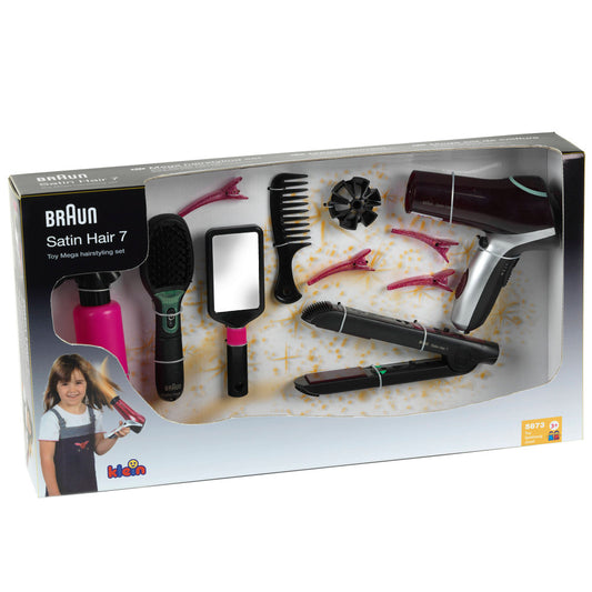 Braun Satin Hair 7 toy hairstyling set in packaging, showing child on model with spray bottle, brush, comb, mirror, hair clips, curling iron, and blow dryer